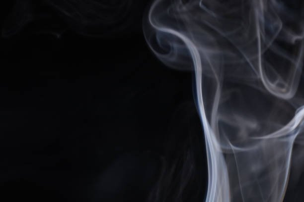 istock White silver smoke on a dark background, colourful abstract 1746162414