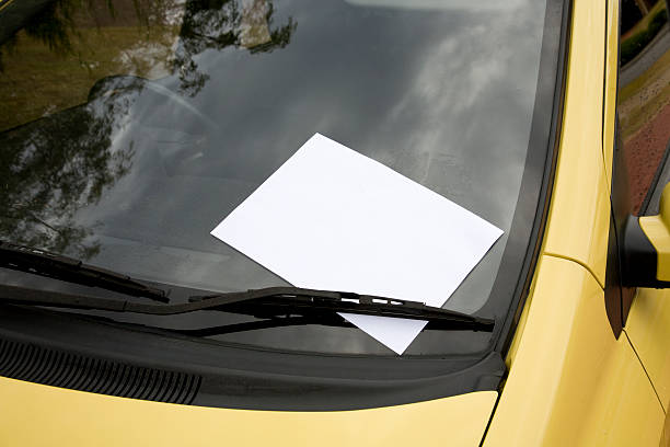 Blank Note on Windscreen. A note left under windscreen wipers of a car add own text. windshield wiper photos stock pictures, royalty-free photos & images