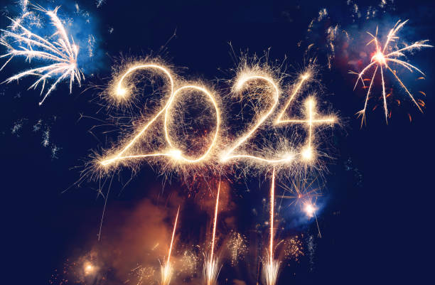 istock Sparkler Happy New Year 2024 with fireworks 1746165293