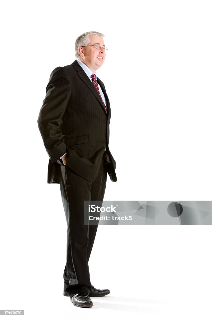 relaxed business A side on portrait of a smiling business man in a relaxed pose with his hands in his pockets. 30-39 Years Stock Photo