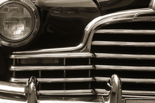 Vintage car close up. Toned and film grain added.