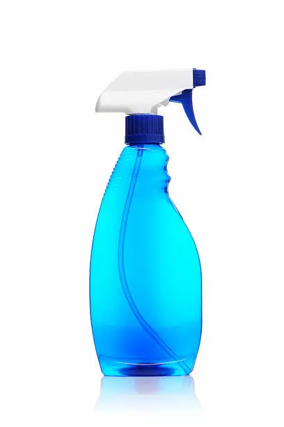 Photo of Spray bottle of blue window cleaner on a white background