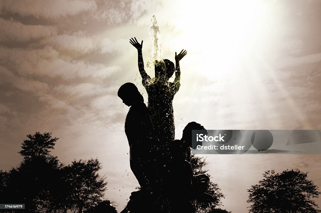 Worship Worship. A fountain of children at a church entrance. Arms Raised Stock Photo