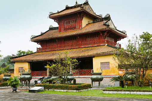 A palace bulging in the Forbidden Purple City of Hue, Vietnam, an architectural fort and cultural travel destination for tourism and a historically famous place and national landmark in Central Vietnam, Southeast Asia.