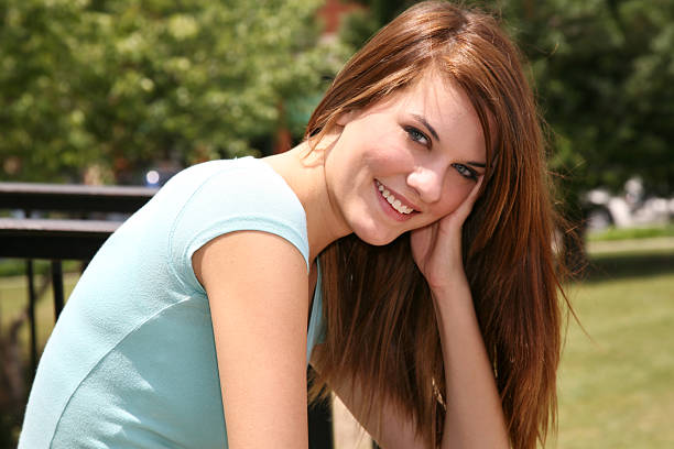 istock Relaxed Girl Sitting In The Sun On A Spring Day 174617866