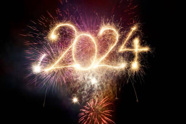 istock Sparkler Happy New Year 2024 with fireworks 1746178987