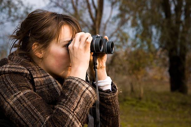 istock Girl Looking With Binoculars Searching and Scouting Outdoors 174617916