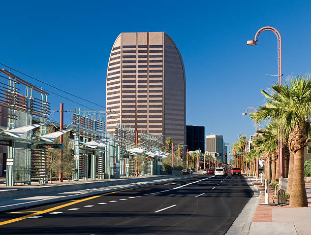 View down Central Avenue in Midtown Phoenix showing Midtown's highrise buildings and Phoenix's new light rail system.