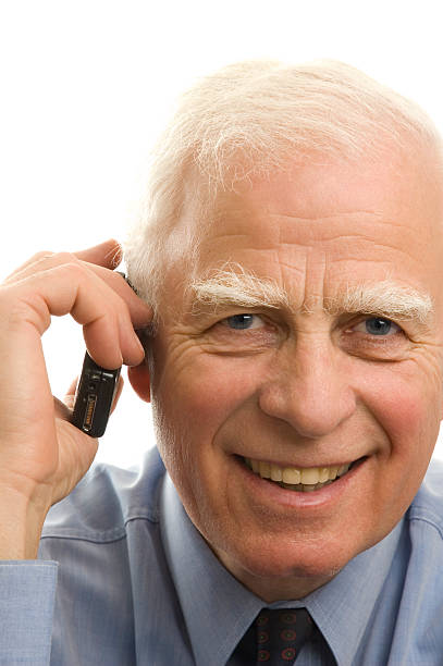 Senior man on a mobile phone stock photo