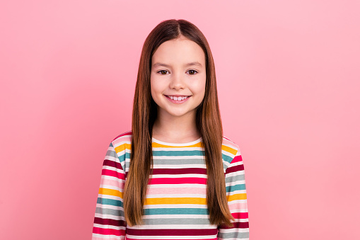 Photo portrait of toothy beaming smile beautiful funky girl smiling good mood positive atmosphere isolated on pink color background.