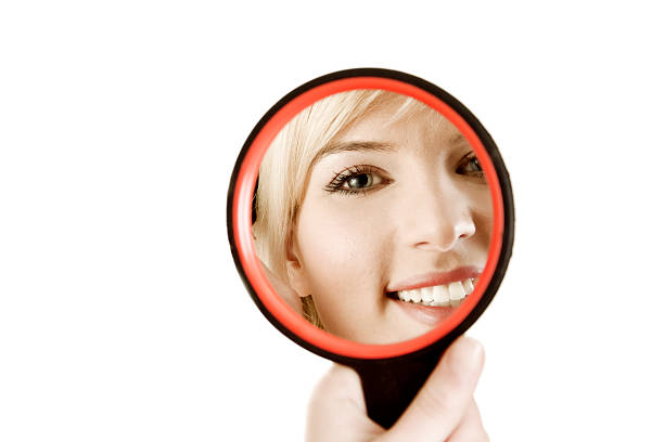 istock Young pretty women holding mirror 174618629