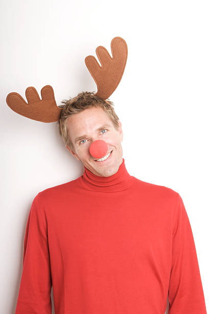 istock Christmas Holiday Reindeer Man Smiling with Red Nose 174618683