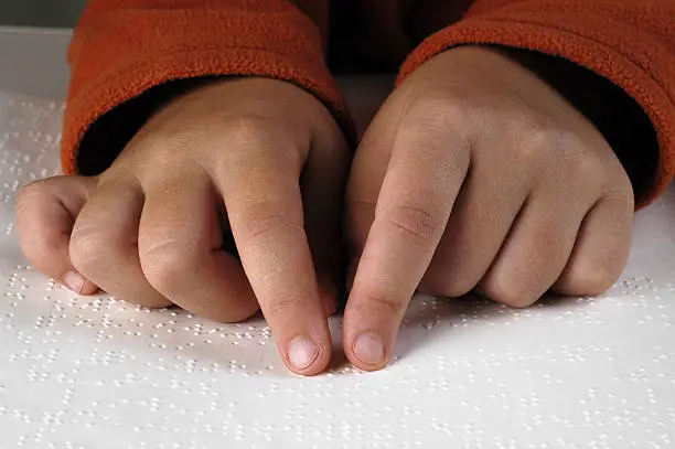 Reading with the fingers.Braille Lightbox: