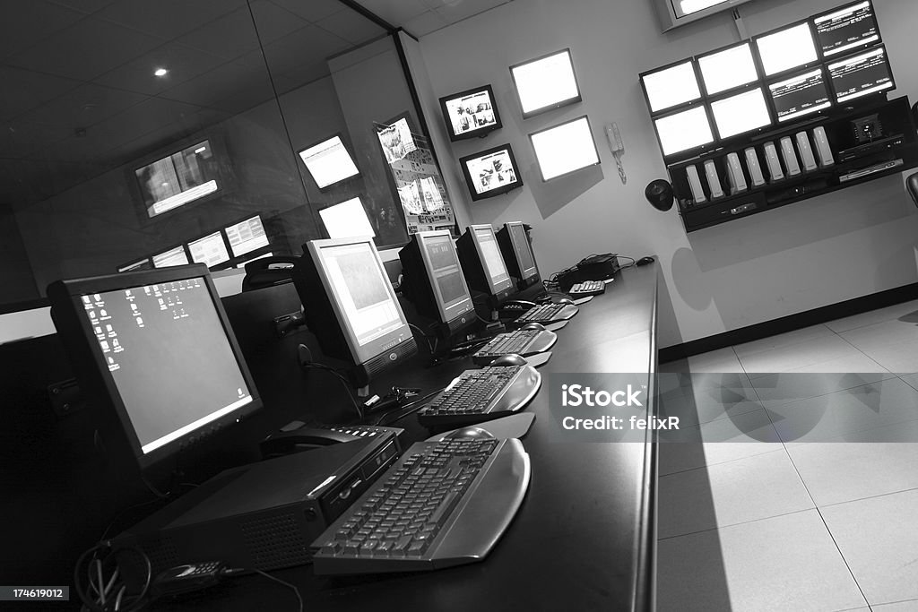 Operations Room A row of terminals and monitors in an Operations Data Centre in Black & White. Data Center Stock Photo