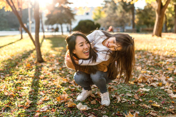 istock Piggyback run through autumn park 1746190701