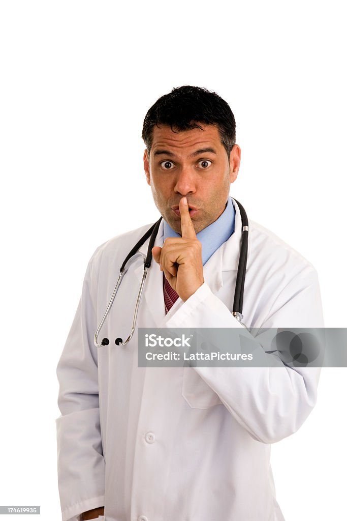 Ispano maschio medico Esprimere a gesti per molto un Dito in bocca - Foto stock royalty-free di 35-39 anni
