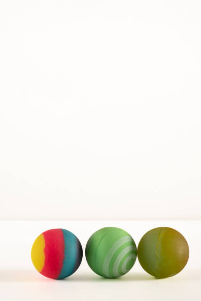 istock Rubber ball of various colors on a keyboard. 1746201693