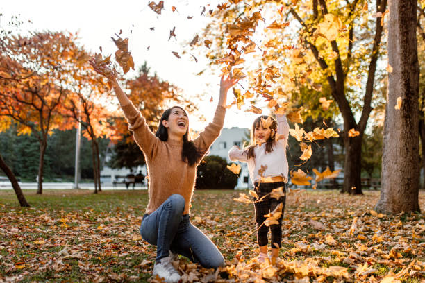 istock Playing with autumn leaves on a sunny day in park 1746202881
