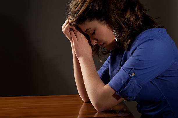 Teen with Head Down stock photo