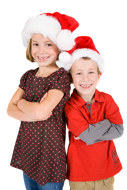 istock Brother and sister wearing Santa hats 174620681