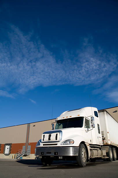 istock White Truck at a warehouse 174621301