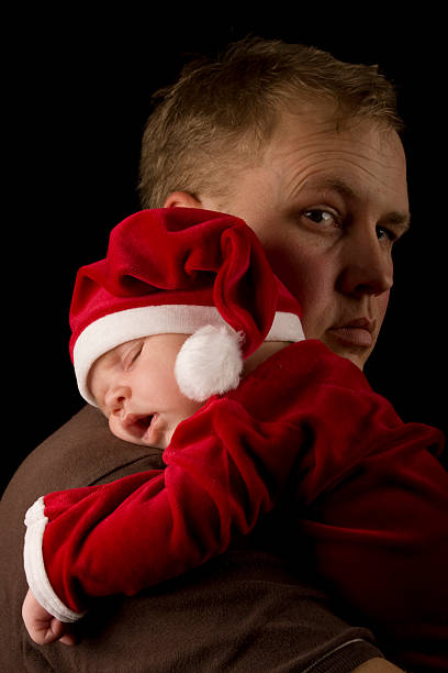 istock Father holding christmas child 174621434