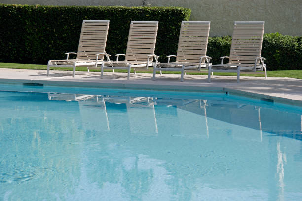 istock Lounge Chairs At Poolside. No People 174621573