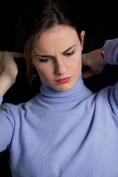 istock Girl tying up her hair 174622056