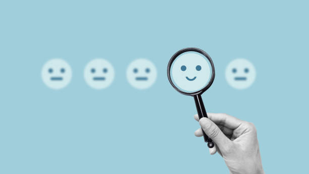 istock Collage with hand choosing between the negative and the positive emotions. Sad and joyful face in the hand 1746223036