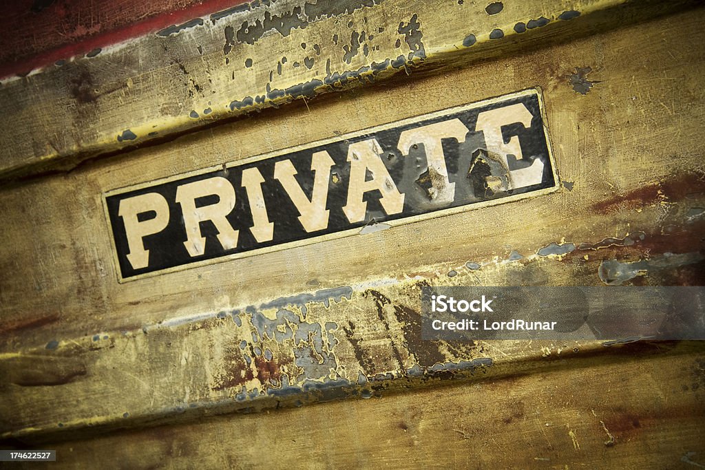 Private sign Dirty weathered metal surface/wall with private sign. Building Exterior Stock Photo