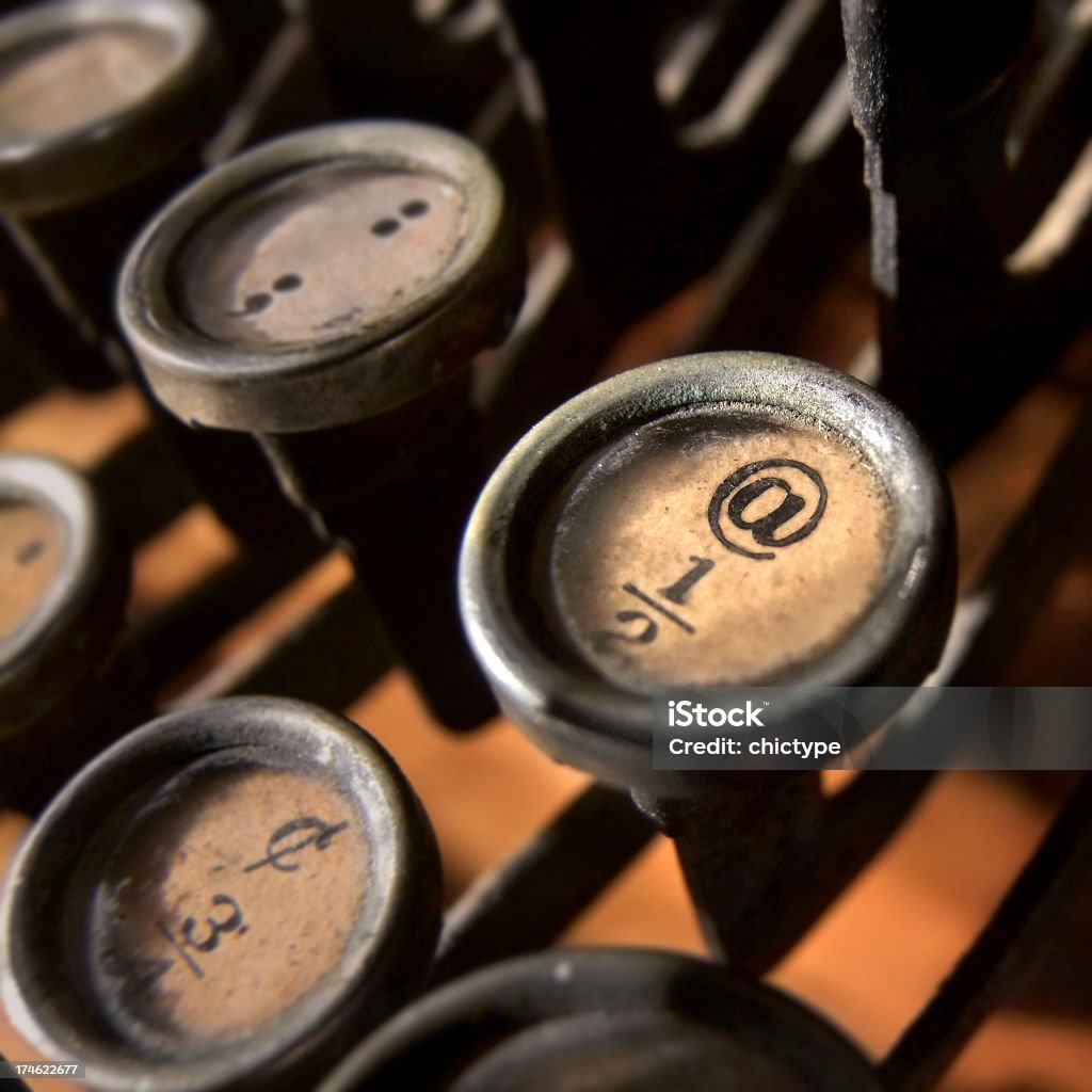 @ on a typewriter key Close-up on the @ key on a typewriter keyboard.  'at' Symbol Stock Photo
