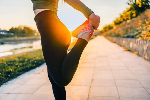 istock Sporty woman doing stretching exercise outdoors 1746229789