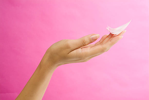istock Lady's hand gently holding fluff 174623001