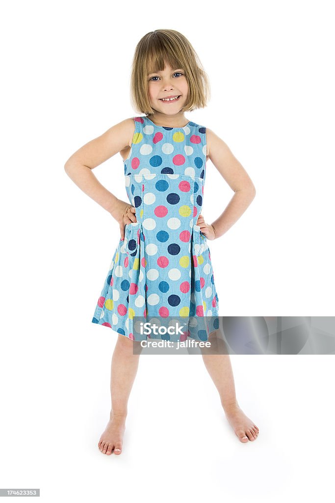 Happy girl with hands on hips on white background Young Girl - Hands On Hips Child Stock Photo