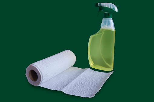 Sprey Bottle With Green Liquid Detergent And Paper Towel