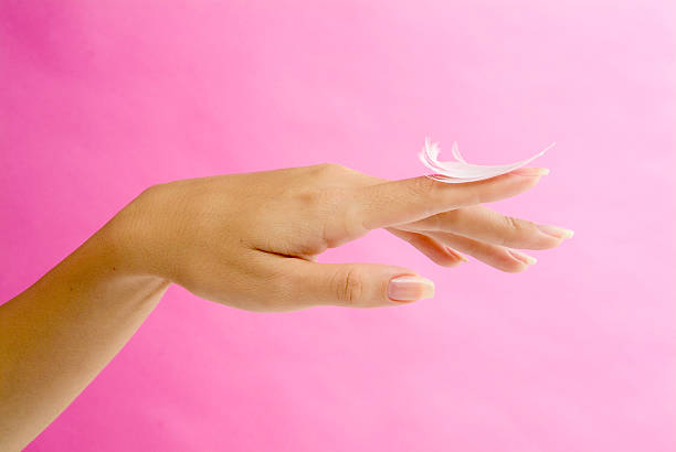 Lady's hand gently holding fluff