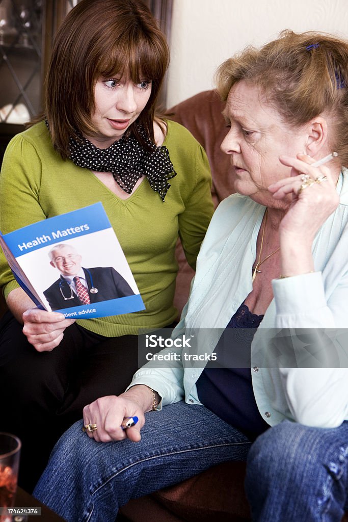 stop smoking An adult daughter attempts to educate her senior mother to take her health more seriously and quit smoking.Property release provided for self-designed leaflet and visible artwork. Adult Offspring Stock Photo