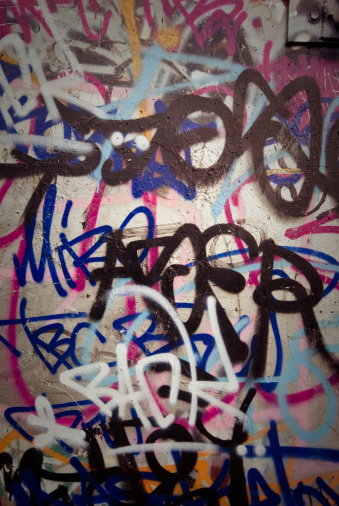 A footbridge covered with graffiti and street art over the railway on Cheshire Street near Brick Lane in the East End of London, UK.