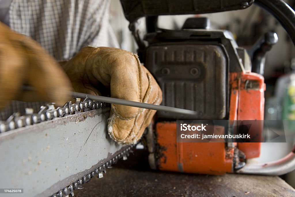 Sharpening a chainsaw Sharpening a chainsaw20081026037See more in my Small Engine Repair lightbox: Chainsaw Stock Photo