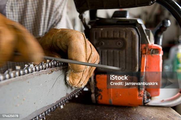 Sharpening A Chainsaw Stock Photo - Download Image Now - Chainsaw, Sharpening, Repairing