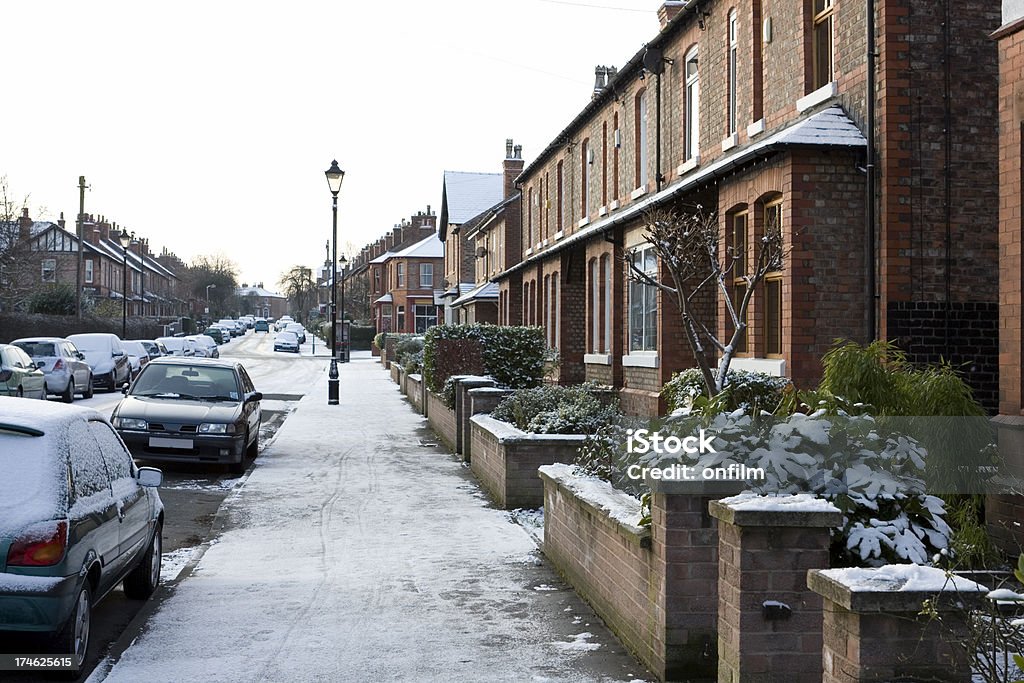 Snow-covered street Cars and houses covered in snow. Location is Altrincham, Cheshire, UK. Snow Stock Photo