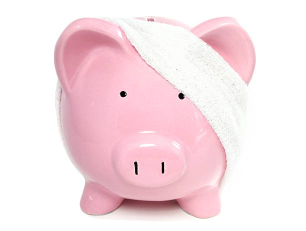 Bandaged Piggy Bank stock photo