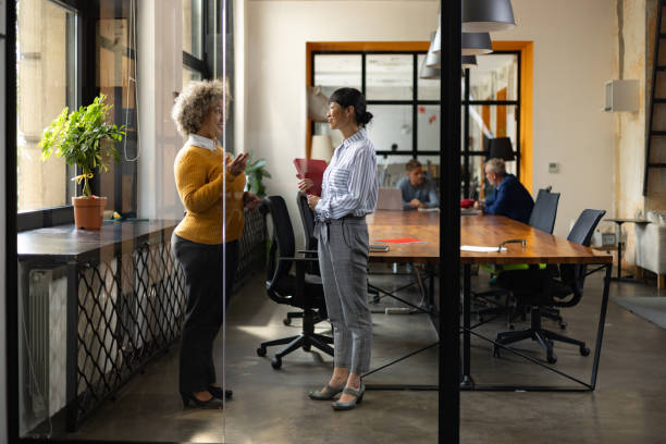 istock Happy female engineers talking in the office. 1746257612