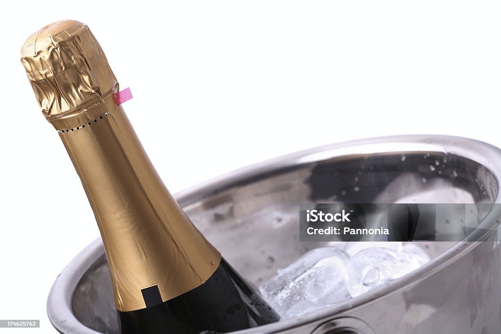 Champagne Bottle in Ice Bucket Champagne Bottle in Ice Bucket -Isolated on White Champagne Stock Photo