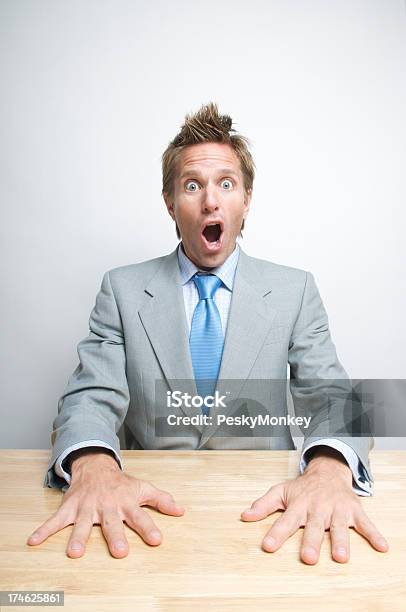 Handsdown Surprise Businessman Sitting At Desk Wide Eyes Stock Photo - Download Image Now