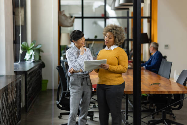 istock Female colleagues working on plans in the office. 1746258790