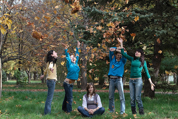 istock people in the autumn park 174626276