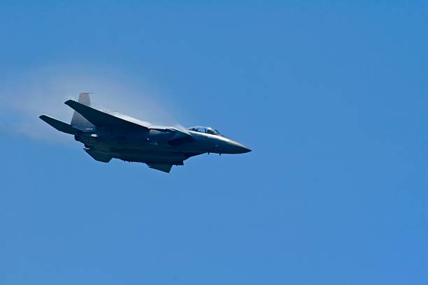 istock f-15 Jet fighter diving hard 174626363