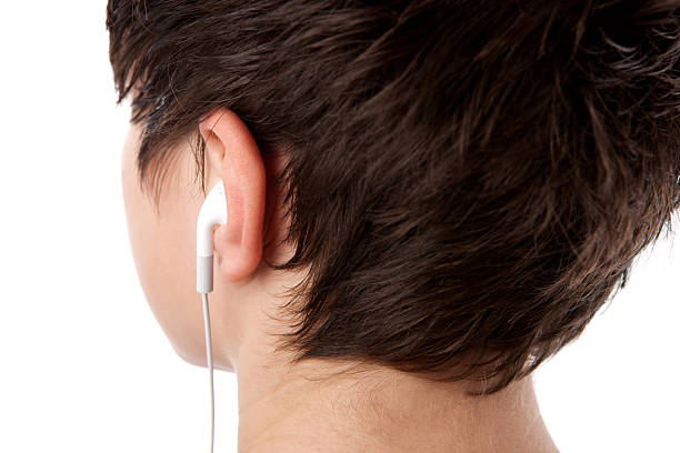 Back of a head of a teenager with earbuds. Taken in studio with Canon Eos 1 DS Mark 3