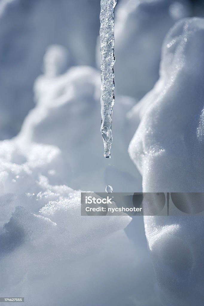 Icicles dripping Icicle dripping against a frozen background.Please Also See: Arctic Stock Photo